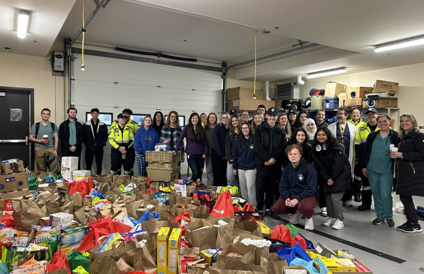 Group photo with donations in front